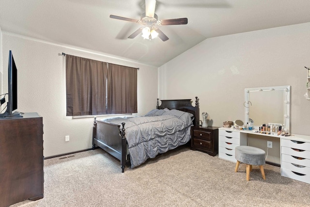 bedroom with light colored carpet, ceiling fan, visible vents, and vaulted ceiling