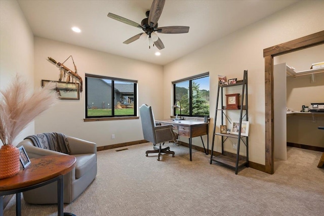 office area featuring recessed lighting, light carpet, baseboards, visible vents, and a ceiling fan