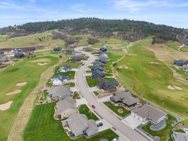 drone / aerial view featuring a residential view and golf course view