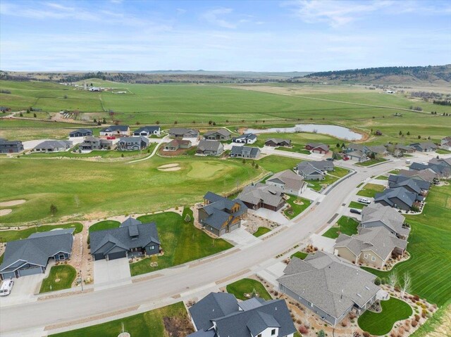 bird's eye view featuring a water view and a residential view