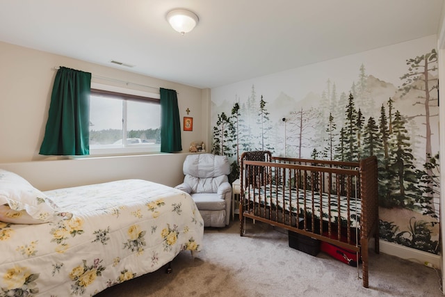 carpeted bedroom featuring visible vents