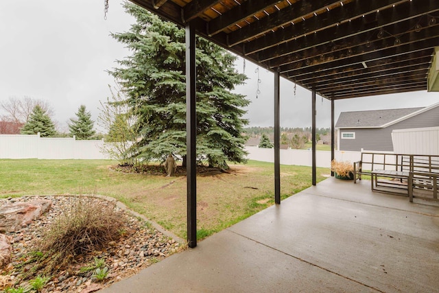 view of patio featuring fence