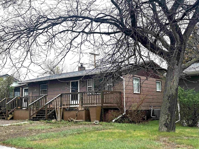 306 10th Ave, Edgemont, SD 57735 - view of front of property with a wooden deck, a chimney, and stairs