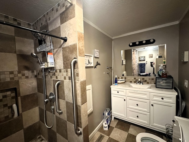 306 10th Ave, Edgemont, SD 57735 - full bath with crown molding, a shower stall, vanity, baseboards, and tasteful backsplash