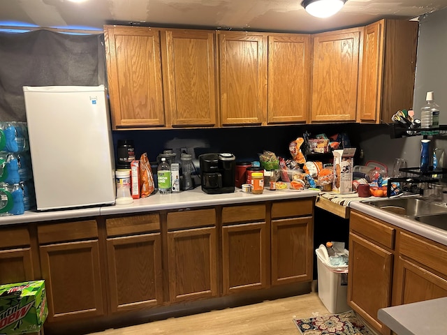 306 10th Ave, Edgemont, SD 57735 - kitchen featuring light countertops and light wood-style floors