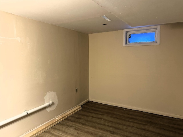 306 10th Ave, Edgemont, SD 57735 - finished below grade area with dark wood-style flooring and baseboards
