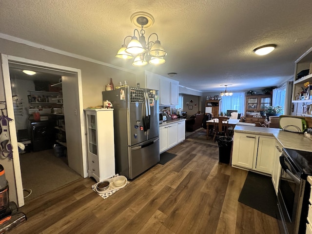 306 10th Ave, Edgemont, SD 57735 - kitchen with a chandelier, electric stove, freestanding refrigerator, a textured ceiling, and dark wood finished floors