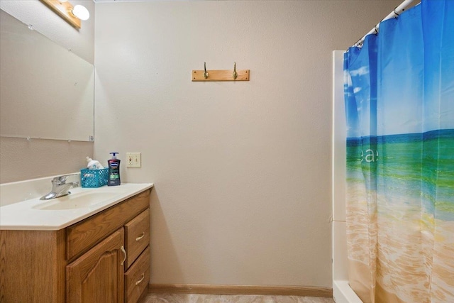 bathroom with vanity and a shower with shower curtain