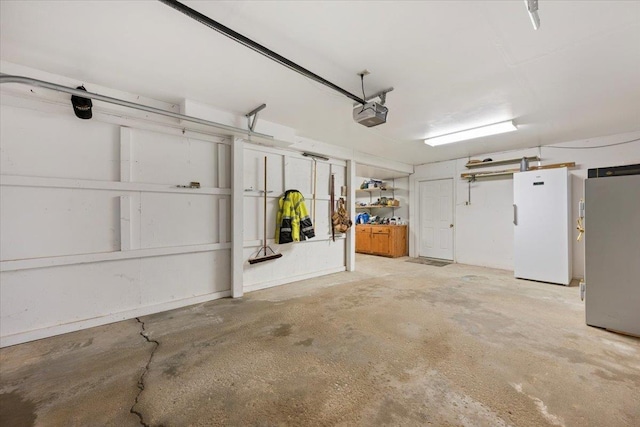 garage with freestanding refrigerator
