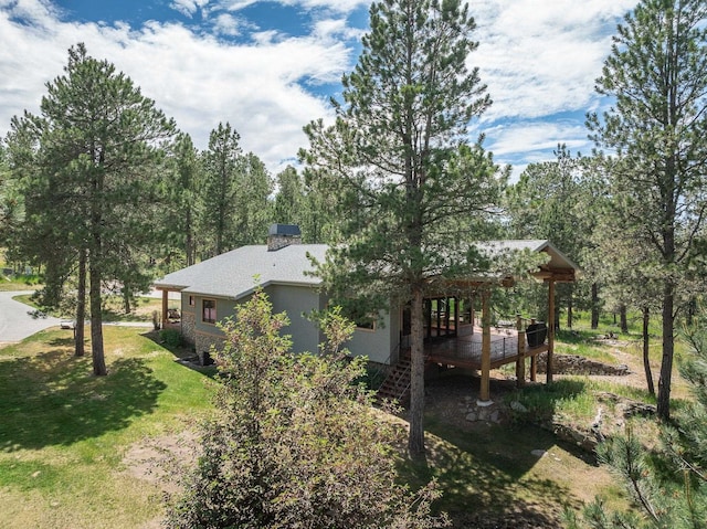 25189 Steckelberg Valley Rd, Custer, SD 57730 - view of side of home with a lawn, a deck, and stairway