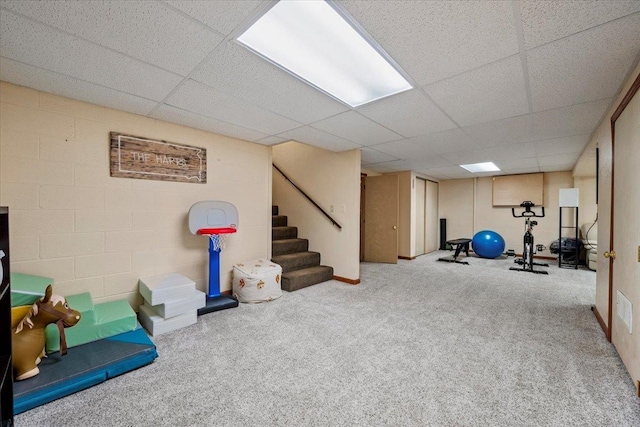 902 Yuma St, Belle Fourche, SD 57717 - workout area with carpet floors, concrete block wall, and a drop ceiling
