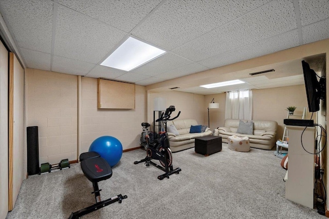902 Yuma St, Belle Fourche, SD 57717 - exercise room with concrete block wall, carpet floors, visible vents, and a paneled ceiling