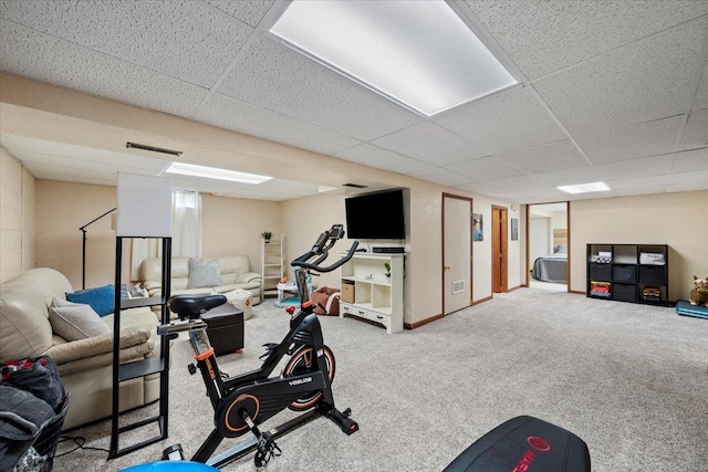 902 Yuma St, Belle Fourche, SD 57717 - exercise room featuring carpet floors, baseboards, visible vents, and a drop ceiling