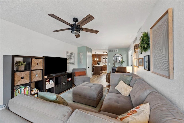 902 Yuma St, Belle Fourche, SD 57717 - living area with visible vents and a ceiling fan