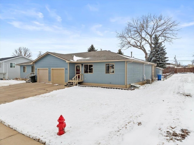 902 Yuma St, Belle Fourche, SD 57717 - ranch-style house featuring a garage, fence, and driveway