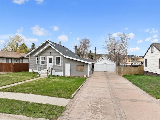 bungalow featuring a detached garage, fence, and a front yard