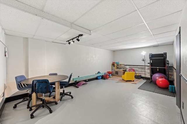 2042 12th Ave, Belle Fourche, SD 57717 - recreation room with finished concrete flooring and a paneled ceiling