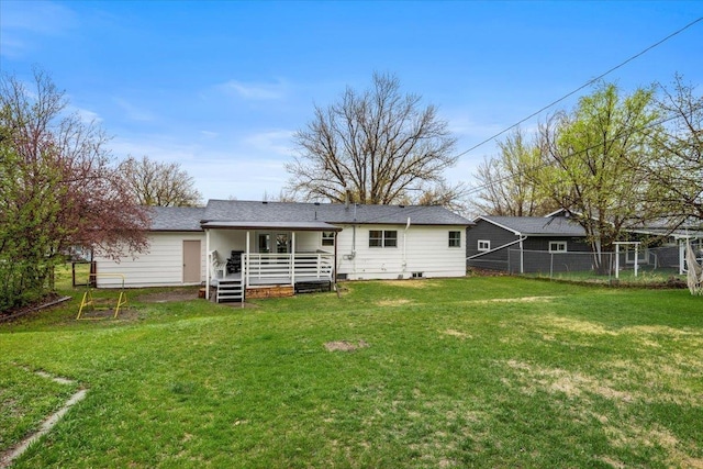 2042 12th Ave, Belle Fourche, SD 57717 - back of property featuring fence, a yard, and a wooden deck