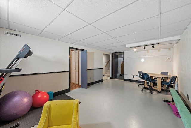 2042 12th Ave, Belle Fourche, SD 57717 - game room featuring finished concrete flooring, baseboards, a drop ceiling, and visible vents