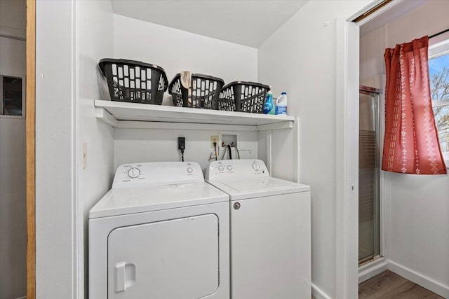 2042 12th Ave, Belle Fourche, SD 57717 - laundry area with baseboards, laundry area, independent washer and dryer, and wood finished floors