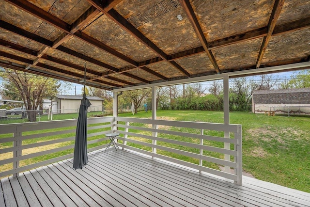 2042 12th Ave, Belle Fourche, SD 57717 - deck with a lawn, fence, and an outdoor structure