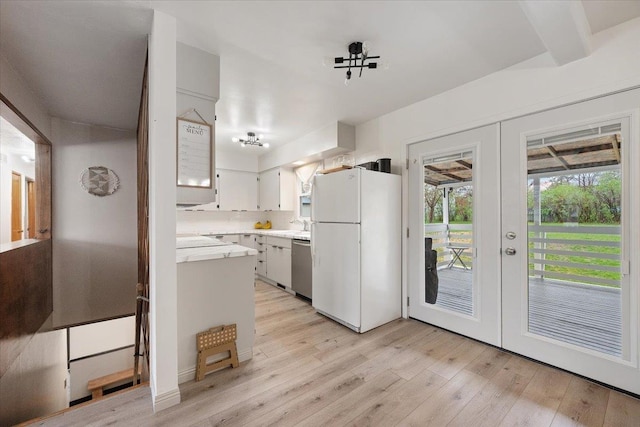 2042 12th Ave, Belle Fourche, SD 57717 - kitchen featuring freestanding refrigerator, light countertops, french doors, light wood-style flooring, and dishwasher