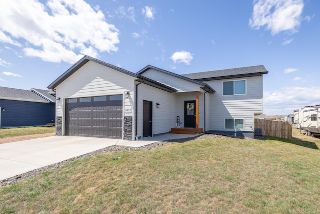 6461 Receda St, Rapid City, SD 57703 - split level home with a garage, fence, driveway, and a front yard