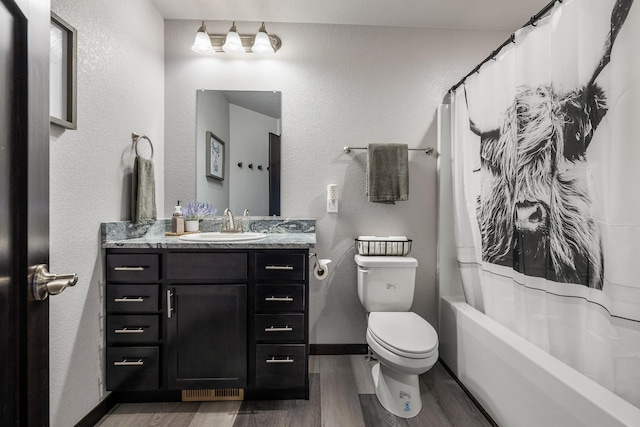 6461 Receda St, Rapid City, SD 57703 - full bath featuring vanity, wood finished floors, toilet, baseboards, and shower / tub combo
