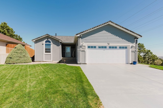 single story home with fence, driveway, a front yard, and a garage