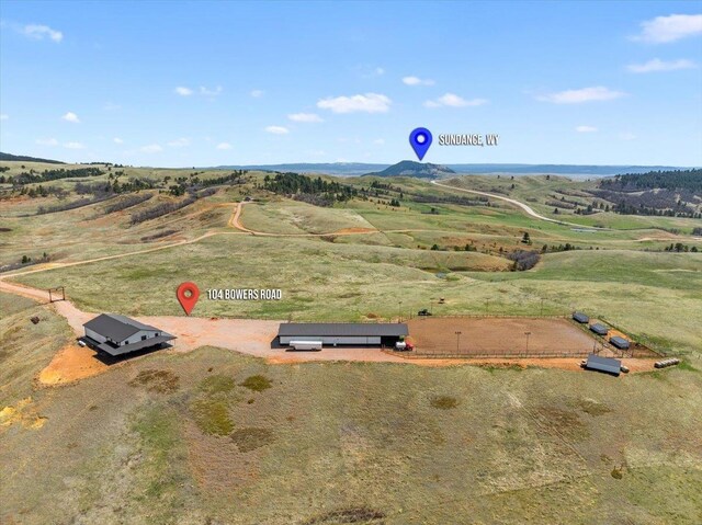 birds eye view of property featuring a rural view