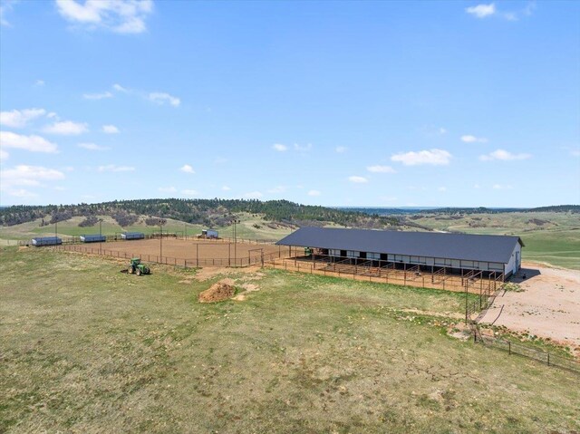 birds eye view of property featuring a rural view
