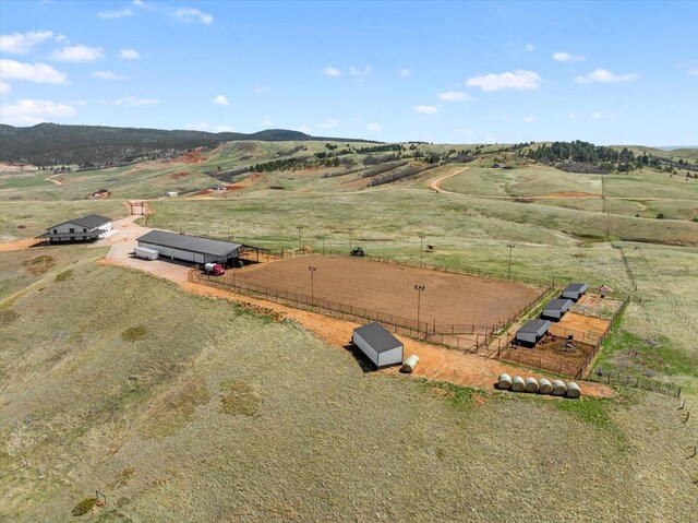 birds eye view of property with a rural view