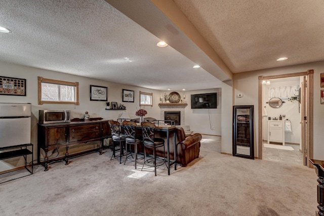 239 Deer Path, Lead, SD 57754 - interior space featuring wine cooler, carpet, recessed lighting, and a textured ceiling