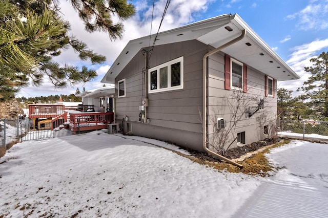 239 Deer Path, Lead, SD 57754 - snow covered rear of property with a deck and fence