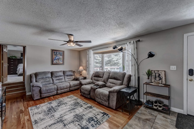 239 Deer Path, Lead, SD 57754 - living area featuring baseboards, a ceiling fan, light wood finished floors, and a textured ceiling