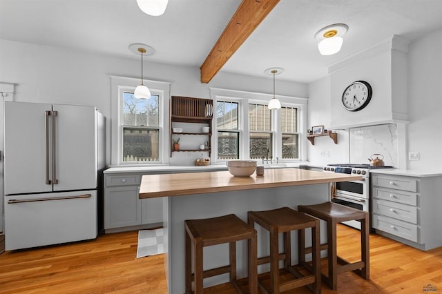 1019 Fulton St, Rapid City, SD 57701 - kitchen featuring gray cabinetry, freestanding refrigerator, double oven range, and open shelves