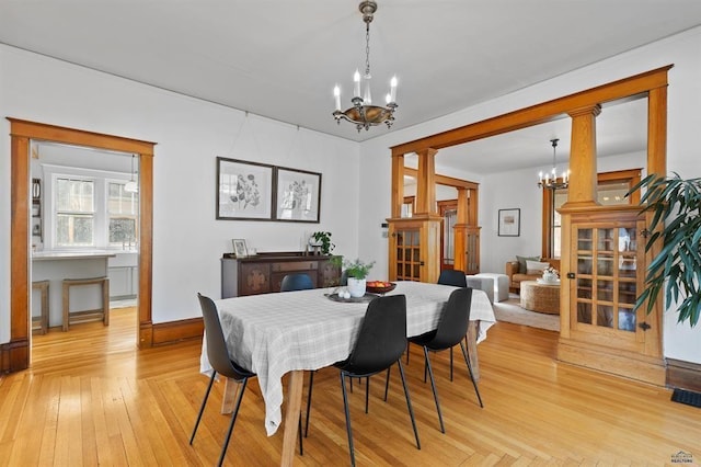 1019 Fulton St, Rapid City, SD 57701 - dining room featuring an inviting chandelier and light wood finished floors