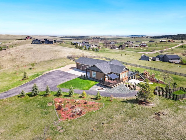 birds eye view of property with a rural view