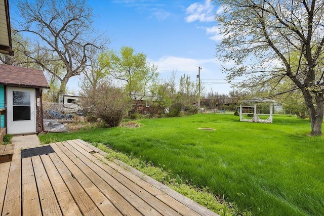 1112 Elkhorn St, Belle Fourche, SD 57717 - view of yard with an outdoor structure and a deck
