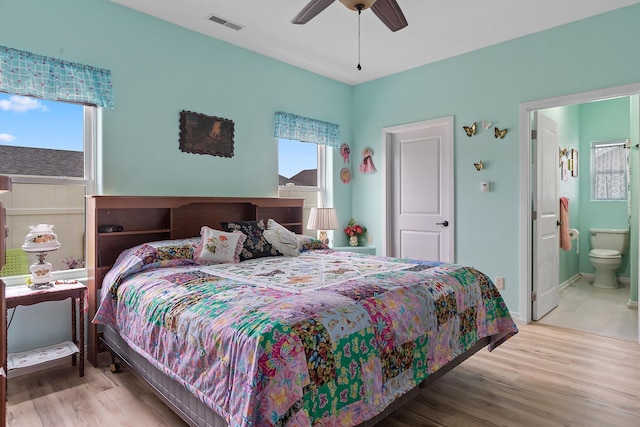 971 Northridge Dr, Rapid City, SD 57701 - bedroom featuring visible vents, multiple windows, and wood finished floors