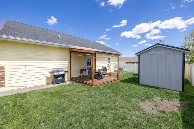 971 Northridge Dr, Rapid City, SD 57701 - rear view of property featuring a wooden deck, an outbuilding, a fenced backyard, and a storage unit