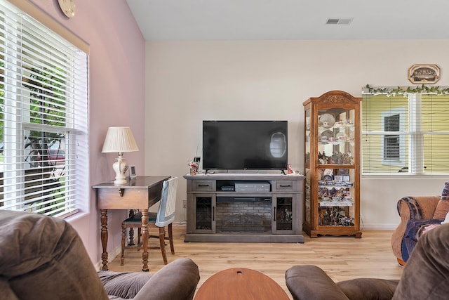 971 Northridge Dr, Rapid City, SD 57701 - living room featuring baseboards, visible vents, plenty of natural light, and wood finished floors