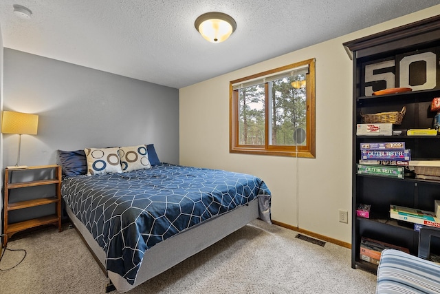 22773 Sunnyside Gulch Rd, Silver City, SD 57702 - carpeted bedroom featuring a textured ceiling, visible vents, and baseboards