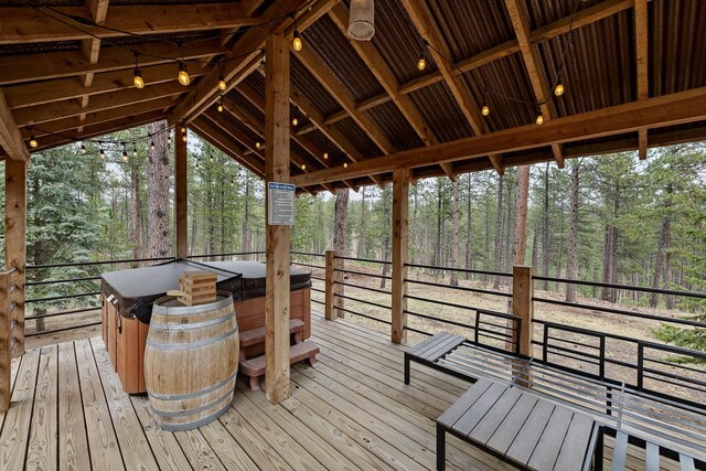 22773 Sunnyside Gulch Rd, Silver City, SD 57702 - wooden terrace featuring a hot tub and a wooded view