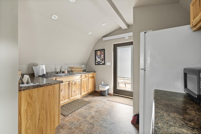 22773 Sunnyside Gulch Rd, Silver City, SD 57702 - kitchen with dark countertops, lofted ceiling with beams, stone finish floor, freestanding refrigerator, and baseboards