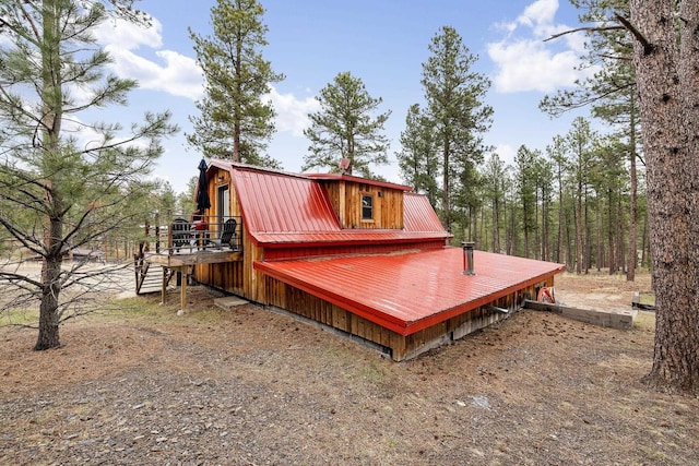 22773 Sunnyside Gulch Rd, Silver City, SD 57702 - rear view of house featuring a gambrel roof, metal roof, and a wooden deck