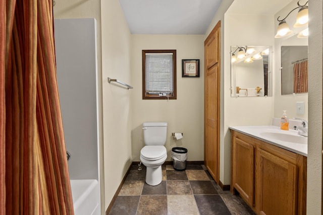 22773 Sunnyside Gulch Rd, Silver City, SD 57702 - full bath featuring toilet, baseboards, stone finish flooring, and vanity