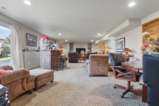 2940 Motherlode Dr, Rapid City, SD 57702 - office with light colored carpet, a large fireplace, visible vents, and recessed lighting