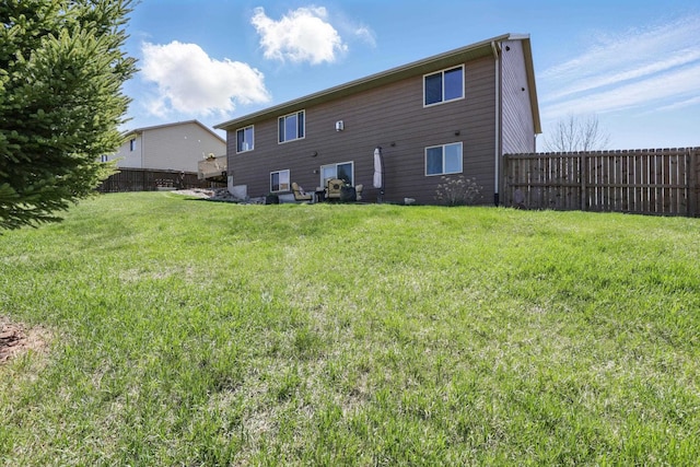 2940 Motherlode Dr, Rapid City, SD 57702 - back of property featuring a yard and fence