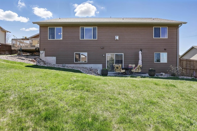 2940 Motherlode Dr, Rapid City, SD 57702 - back of house with a lawn, a wooden deck, and fence